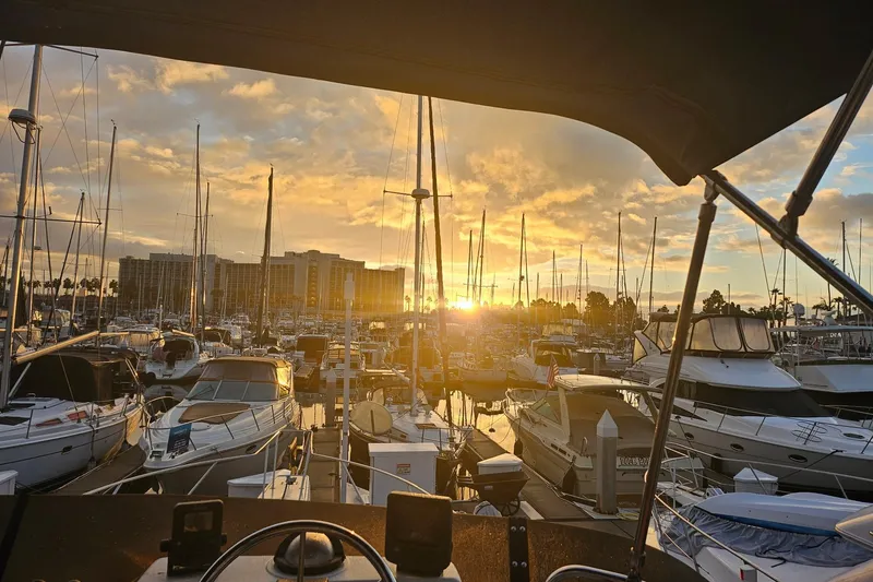 Slide: The Image of Sunset view from a 1988 Silverton 37 Motor Yacht in a marina. - 8