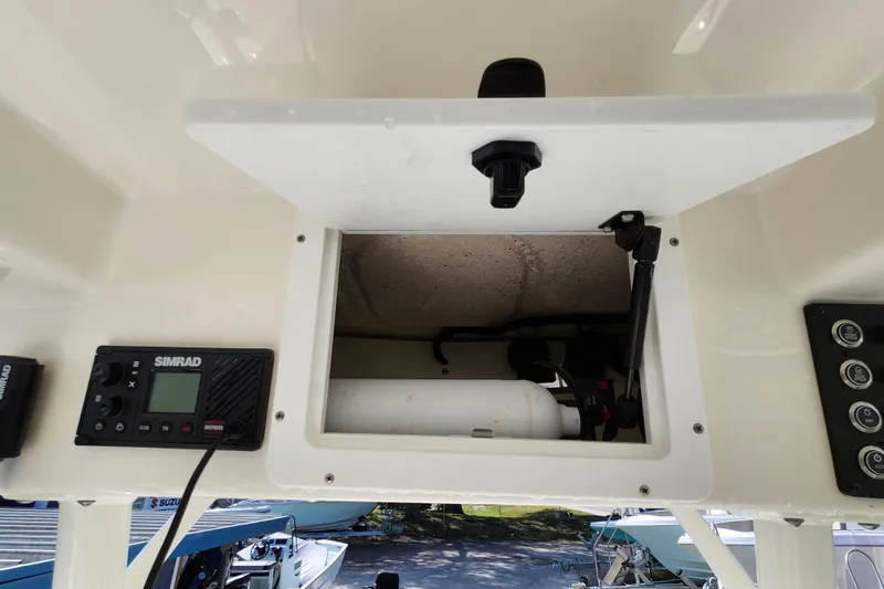 Slide: The Image of 2023 Sea Born FX22 Bay boat console with Simrad electronics and storage compartment. - 19