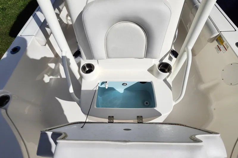 Slide: The Image of 2023 Sea Born FX22 Bay boat interior with seating and storage compartment. - 24