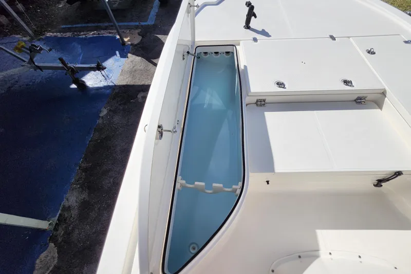 Slide: The Image of 2023 Sea Born FX22 Bay boat interior with open storage compartment. - 27