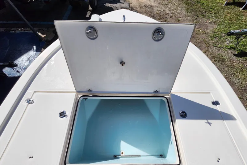 Slide: The Image of 2023 Sea Born FX22 Bay boat with open storage compartment on deck. - 29