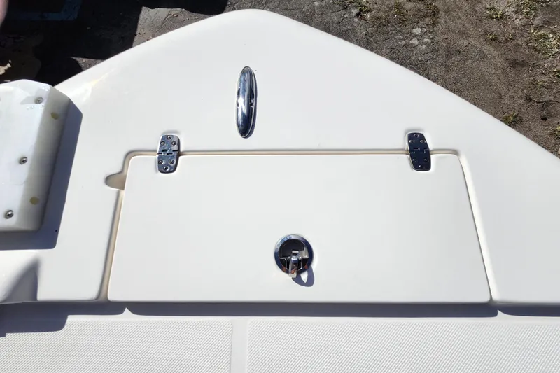 Slide: The Image of 2023 Sea Born FX22 Bay boat deck with storage compartment and latch. - 30