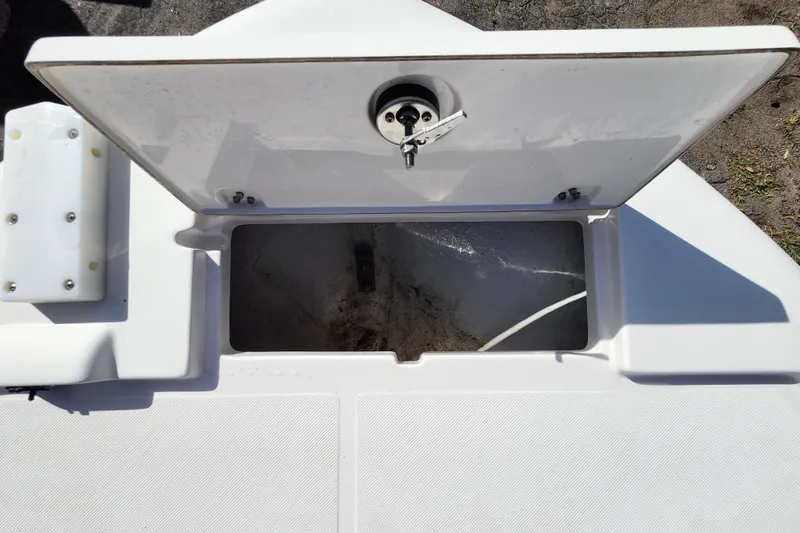 Slide: The Image of Open storage compartment on 2023 Sea Born FX22 Bay boat deck. - 31