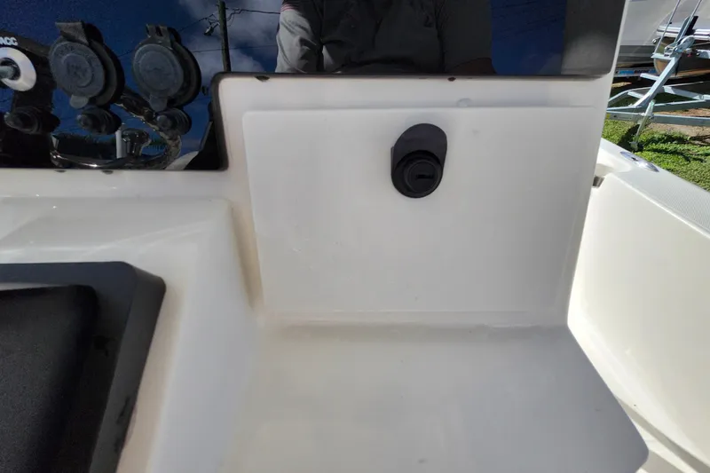 Slide: The Image of 2023 Sea Born FX22 Bay boat dashboard with control panel and switches. - 33