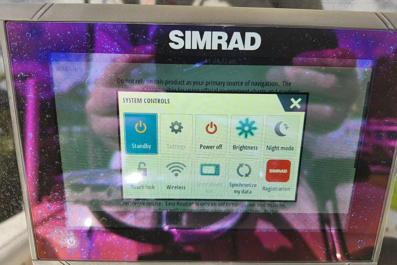 Slide: The Image of Simrad system controls display on a 2023 Sea Born FX22 Bay boat. - 42