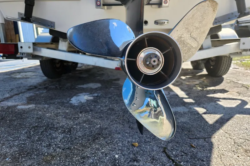 Slide: The Image of 2023 Sea Born FX22 Bay boat propeller on trailer, close-up view. - 45