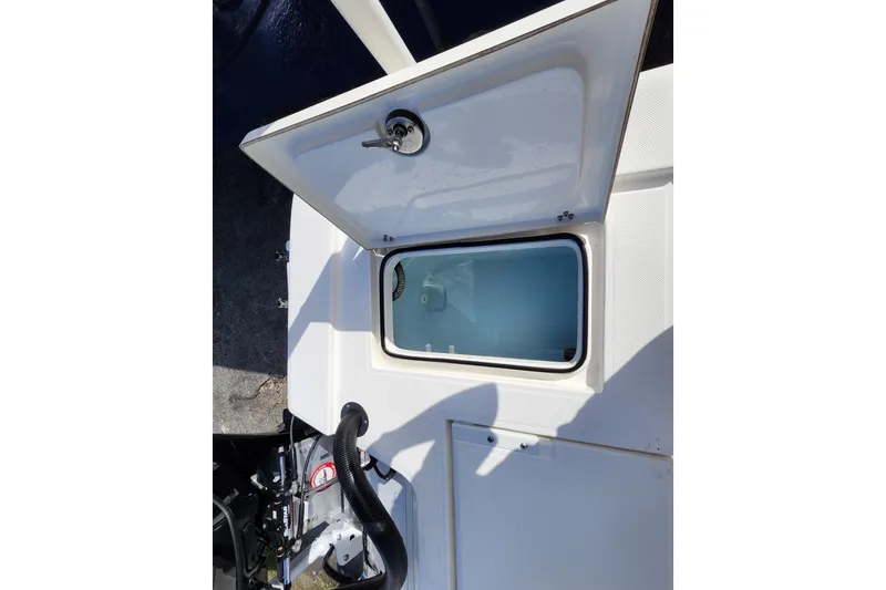 Slide: The Image of 2023 Sea Born FX22 Bay boat storage compartment with open lid. - 8