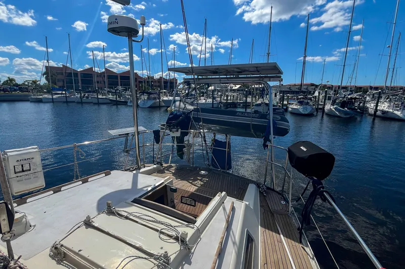 Slide: The Image of Sailboat docked in marina, Oyster LW48, 1991 model, sunny day with blue sky. - 46