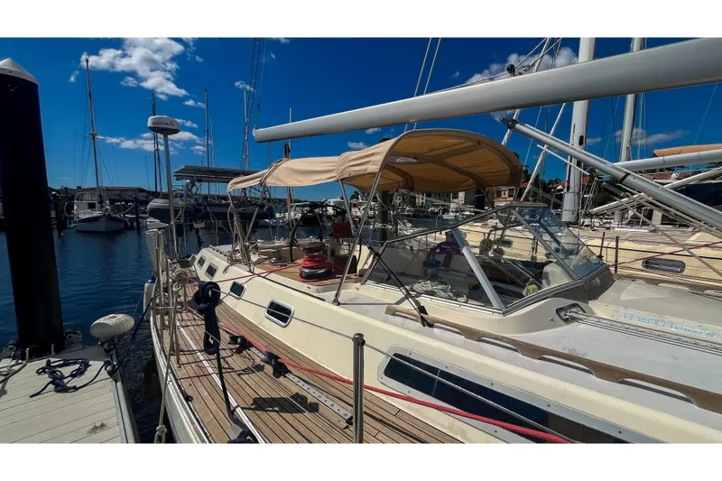 Slide: The Image of Sailboat Oyster LW48 1991 docked at marina under clear blue sky. - 65