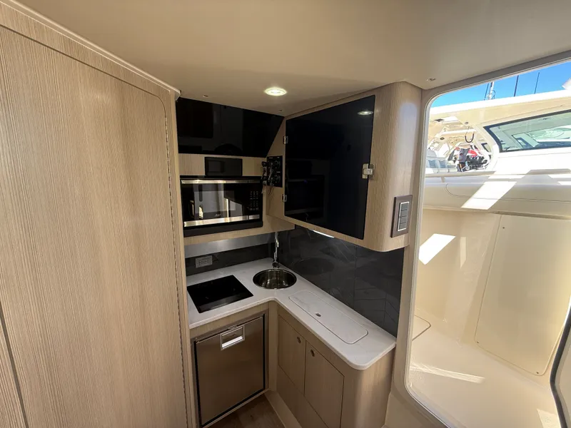 Slide: The Image of Interior of Scout 400 LXF yacht kitchen, 2026 model. - 10