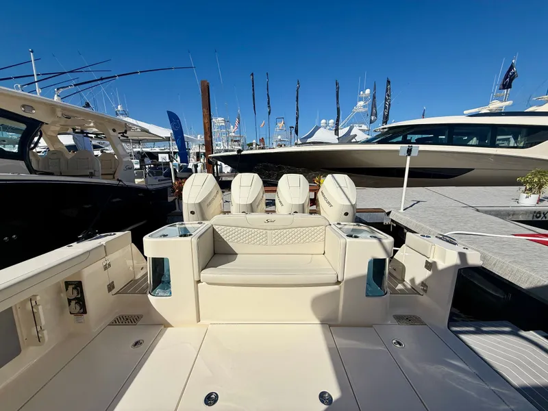 Slide: The Image of Scout 400 LXF 2026 at a boat show, luxurious design. - 4