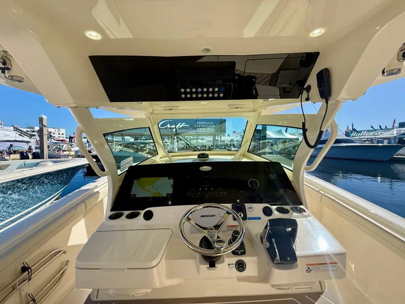Slide: The Image of Interior view of 2026 Scout 400 LXF boat cockpit at dock. - 6