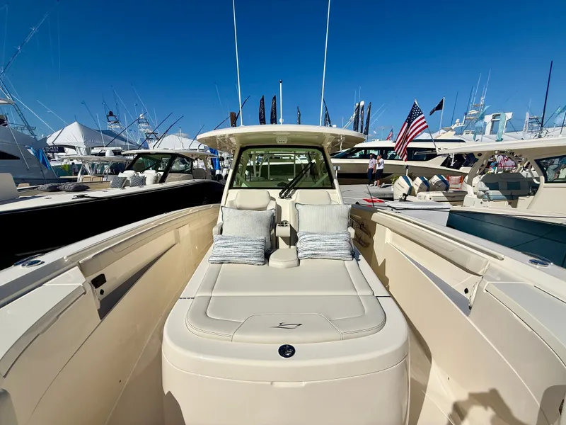 Slide: The Image of Scout 400 LXF 2026 at a boat show, luxurious design. - 7