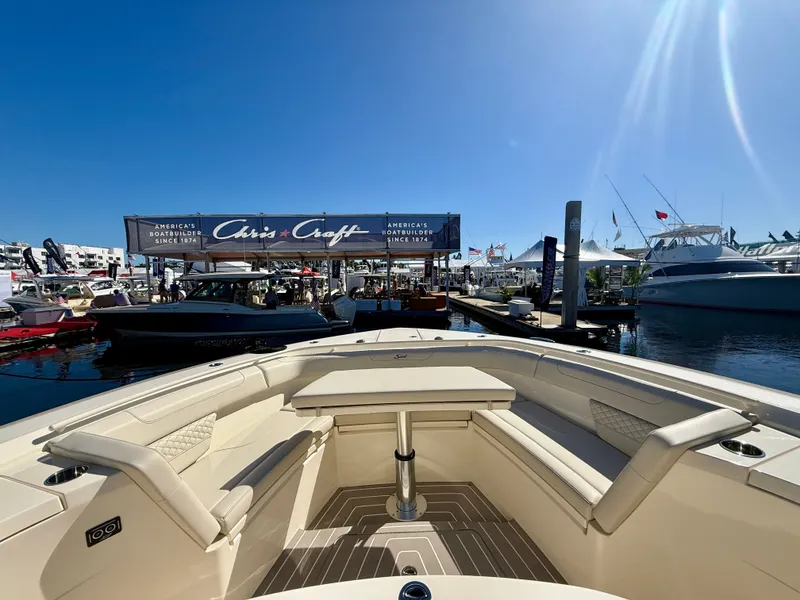 Slide: The Image of Scout 400 LXF 2026 at a boat show with Chris-Craft booth. - 8