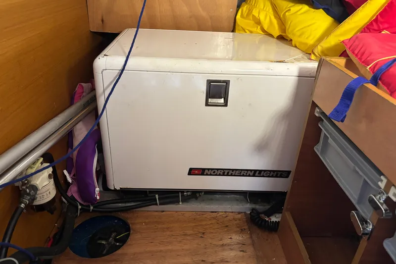 Slide: The Image of Northern Lights generator inside 2018 Jeanneau Sun Odyssey 389 yacht cabin. - 12