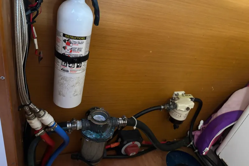 Slide: The Image of Fire extinguisher and plumbing system inside 2018 Jeanneau Sun Odyssey 389 yacht. - 13