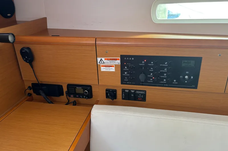 Slide: The Image of Control panel of a 2018 Jeanneau Sun Odyssey 389 sailboat interior. - 18