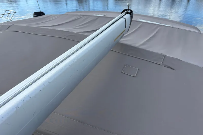 Slide: The Image of 2018 Jeanneau Sun Odyssey 389 sailboat deck with boom, covered in protective canvas. - 25