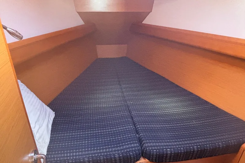 Slide: The Image of Cozy cabin interior of 2018 Jeanneau Sun Odyssey 389 sailboat with comfortable bedding. - 4