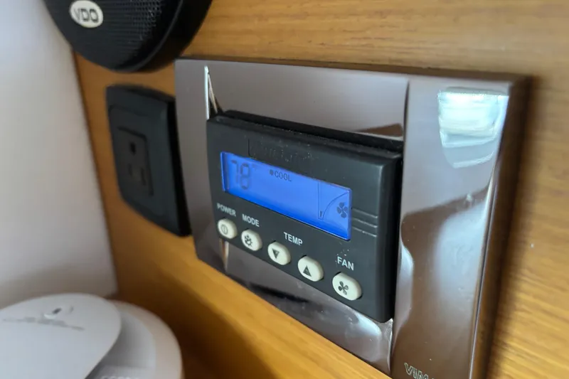 Slide: The Image of Thermostat control panel on 2018 Jeanneau Sun Odyssey 389 yacht interior. - 6