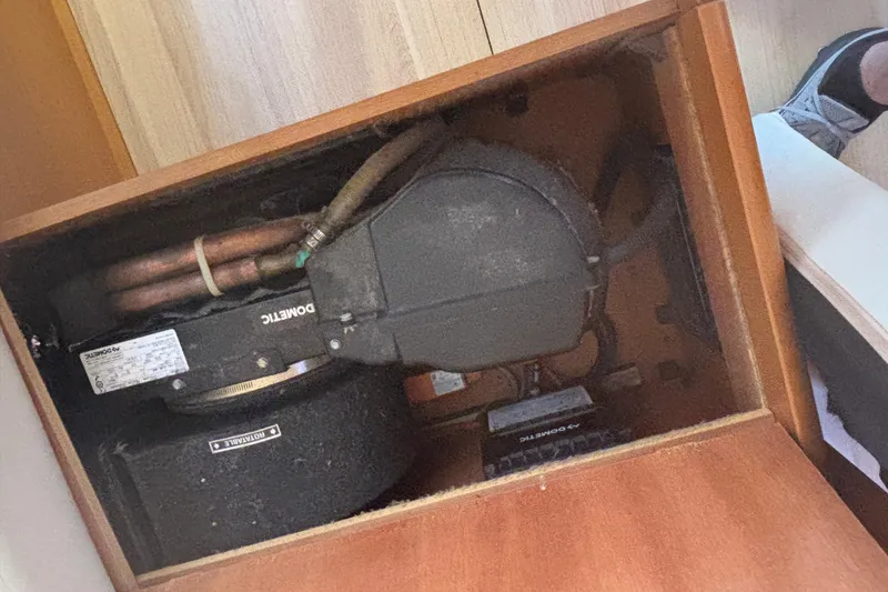 Slide: The Image of 2018 Jeanneau Sun Odyssey 389 interior showing mechanical components and piping. - 7