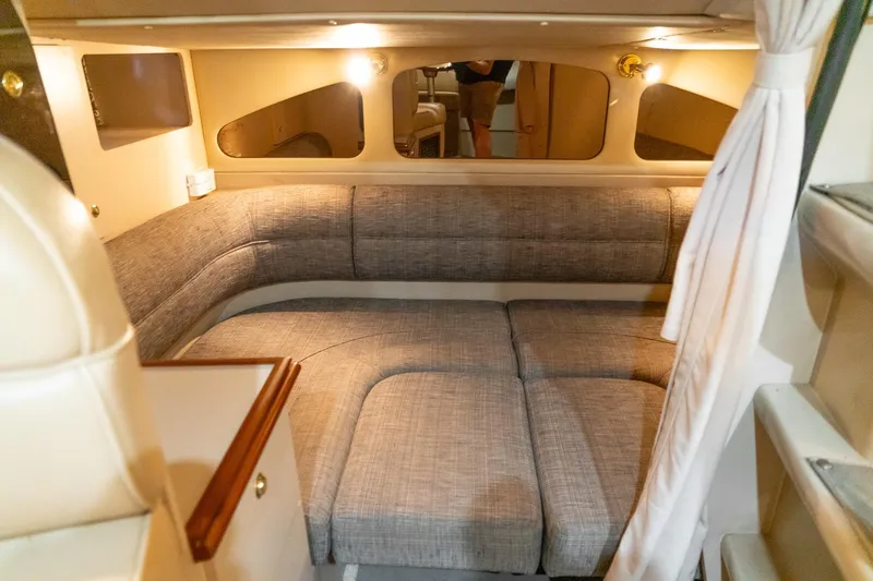 Slide: The Image of Interior cabin of 2000 Cruisers Yachts 3375 Express with cozy seating and ambient lighting. - 24