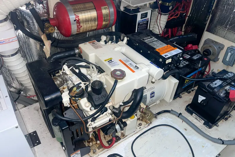 Slide: The Image of Engine room of 2000 Cruisers Yachts 3375 Express with generator and fire suppression system. - 37