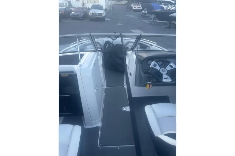 Slide: The Image of 2015 Yamaha Boats AR240 HO interior with steering wheel and seating area. - 3