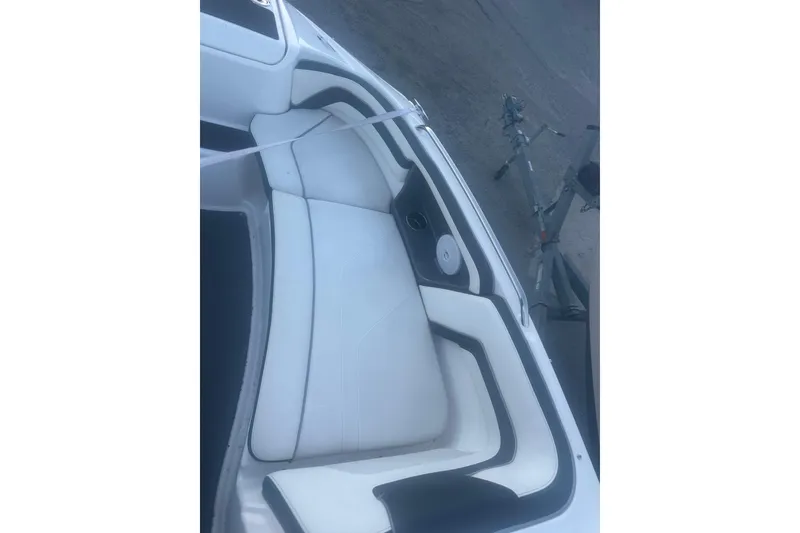 Slide: The Image of 2015 Yamaha AR240 HO boat interior with white and black seating. - 5