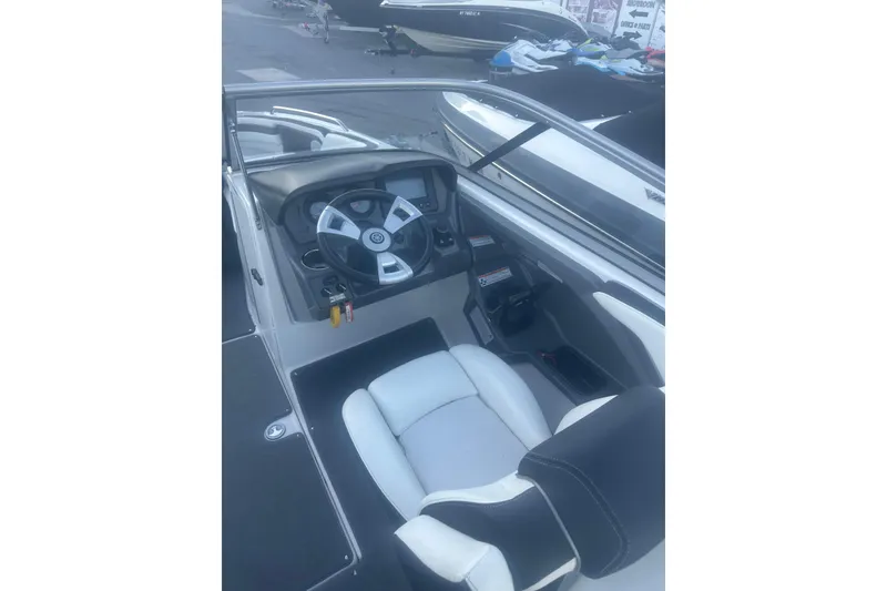 Slide: The Image of 2015 Yamaha Boats AR240 HO cockpit with steering wheel and seating. - 6