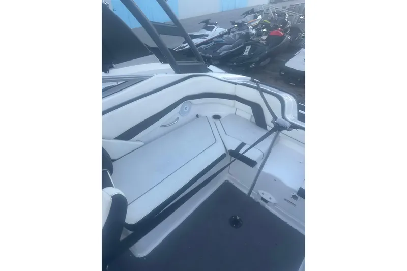 Slide: The Image of 2015 Yamaha Boats AR240 HO interior with white seating and black accents. - 8