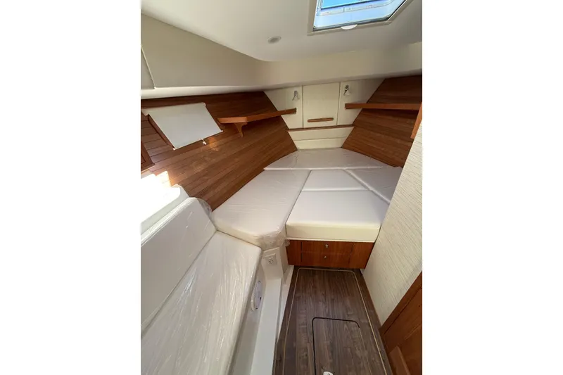 Slide: The Image of Luxurious 2026 MJM 38R yacht interior with ocean view, featuring elegant seating and modern amenities. - 13