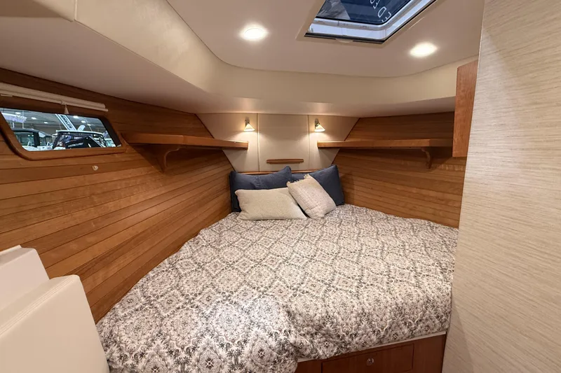 Slide: The Image of Luxurious cabin interior of 2026 MJM 38R yacht with cozy bedding and wooden accents. - 22
