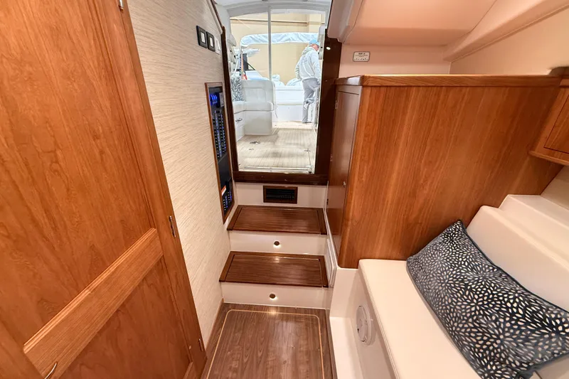 Slide: The Image of Luxurious interior of 2026 MJM 38R yacht with wooden finishes and comfortable seating. - 28
