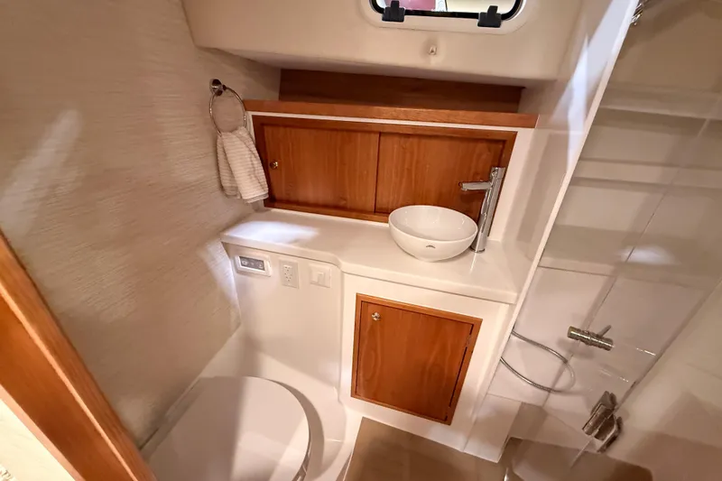Slide: The Image of Luxurious bathroom in 2026 MJM 38R yacht with modern fixtures and wooden cabinetry. - 29