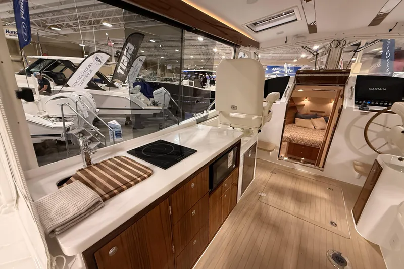 Slide: The Image of Luxurious interior of 2026 MJM 38R yacht featuring modern kitchen and cozy cabin. - 38