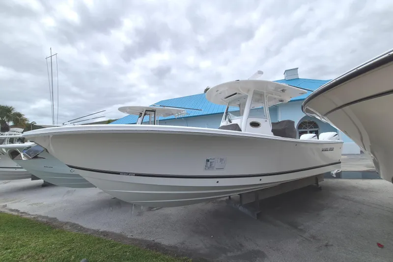 The Image of 2026 Regulator 28 boat displayed outdoors, featuring sleek design and modern build. - 10