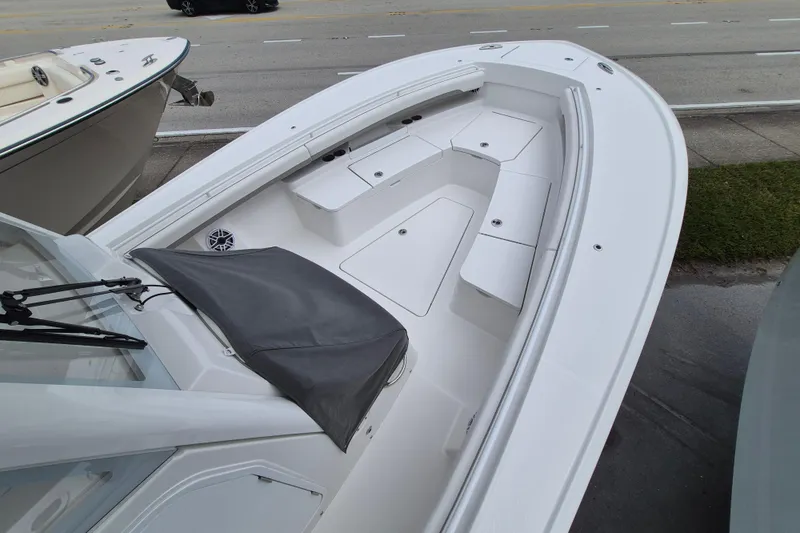 Slide: The Image of 2026 Regulator 28 boat with spacious seating and sleek design. - 12