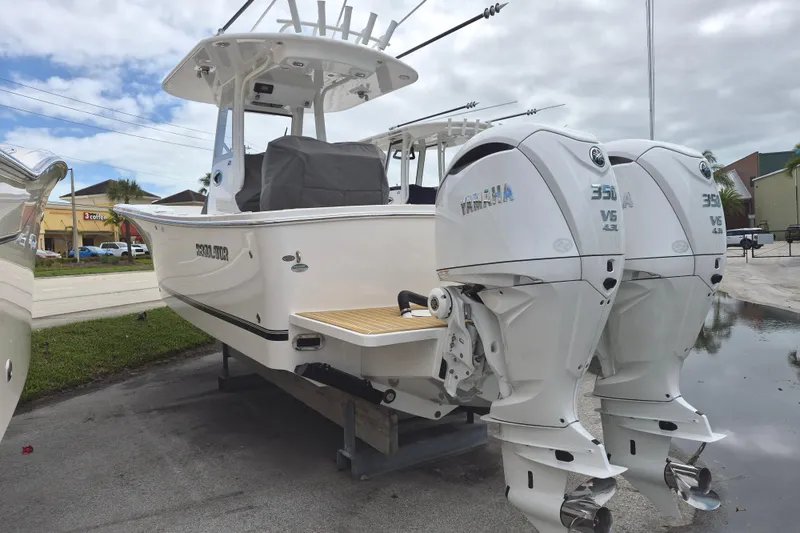 Slide: The Image of 2026 Regulator 28 boat with twin Yamaha 350 V6 engines displayed outdoors. - 15