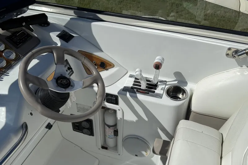 Slide: The Image of 1999 Cobalt 293 boat on trailer, parked in suburban neighborhood driveway. - 22