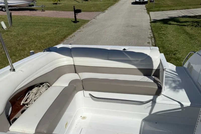 Slide: The Image of 1999 Cobalt 293 boat dashboard with gauges, steering wheel, and navigation equipment. - 23