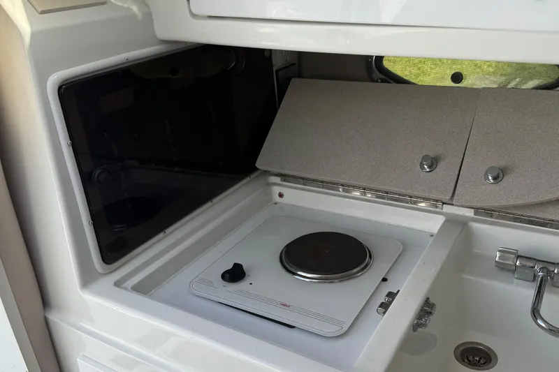 Slide: The Image of Kicker Powered Substation PSR80 in 1999 Cobalt 293 boat interior. - 49