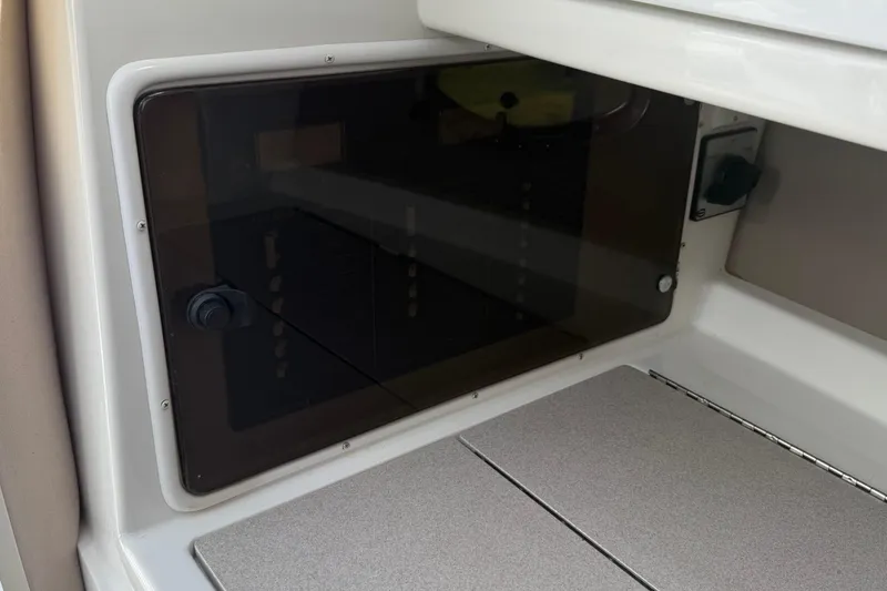 Slide: The Image of Interior view of a 1999 Cobalt 293 boat showing mechanical components and wiring. - 50