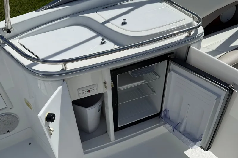 Slide: The Image of Interior of a 1999 Cobalt 293 boat with beige leather seating. - 57