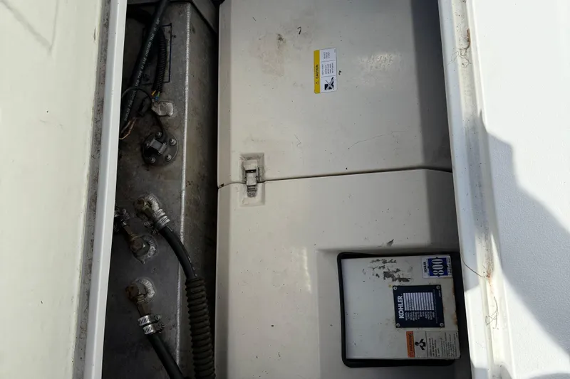 Slide: The Image of Interior cabin of a 1999 Cobalt 293 boat with beige upholstery. - 58