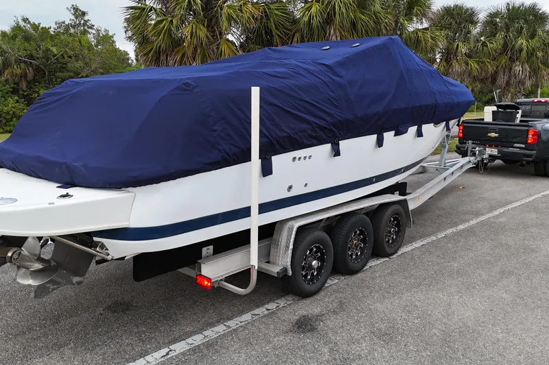 Slide: The Image of Interior view of 1999 Cobalt 293 boat cabin with open door and sunny exterior. - 65