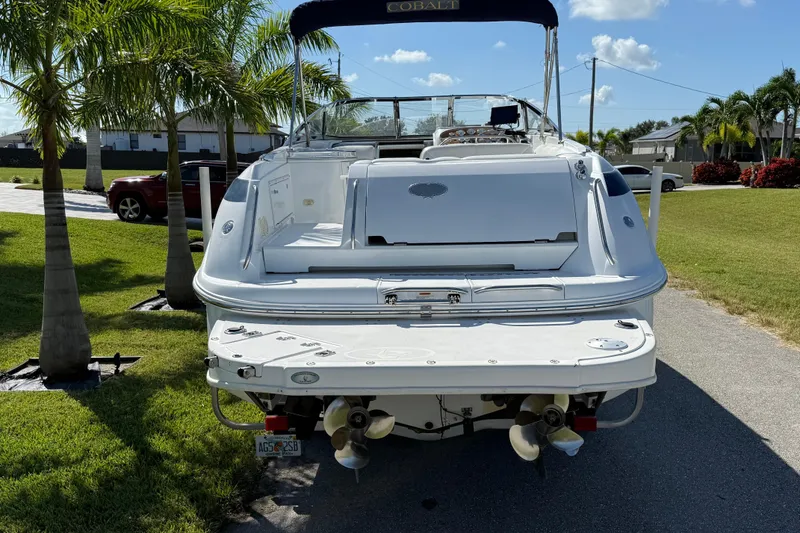 Slide: The Image of 1999 Cobalt 293 boat stored in a garage with open doors. - 7