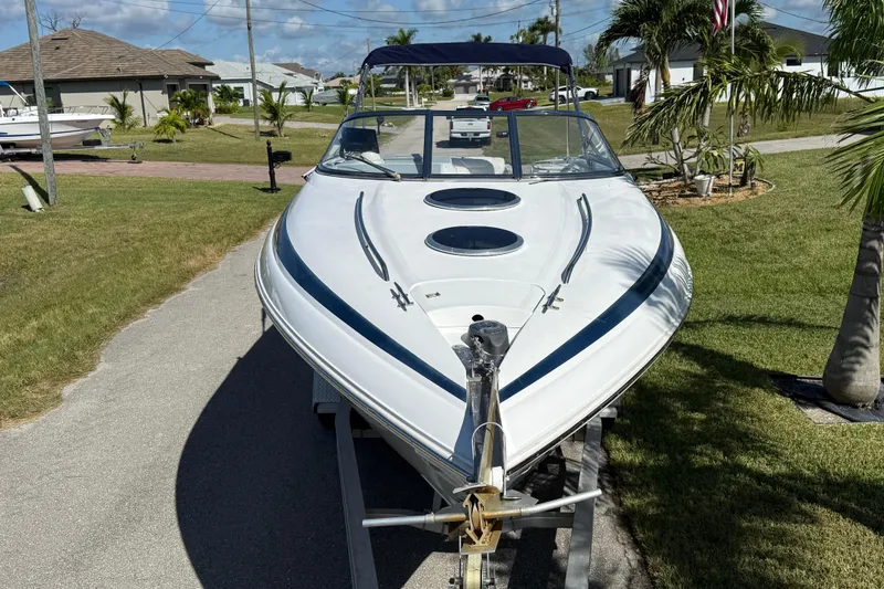 Slide: The Image of Rear view of a 1999 Cobalt 293 boat with dual propellers and ladder. - 8