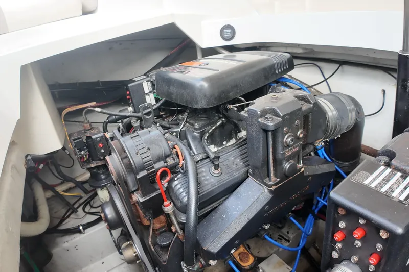 Slide: The Image of Engine compartment of a 1999 Cobalt 293 boat, showcasing mechanical components and wiring. - 90