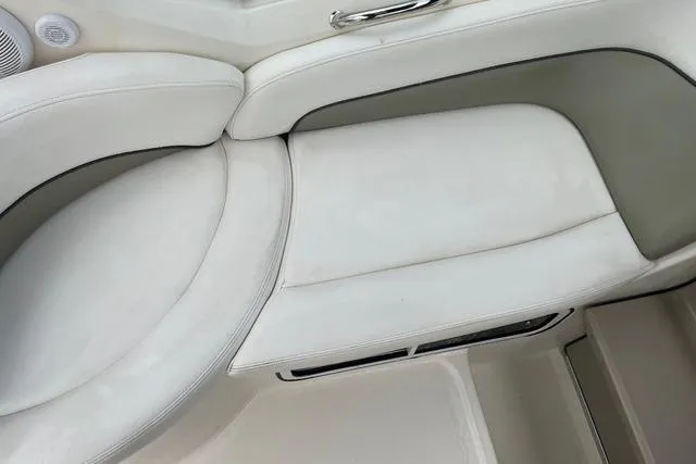 Slide: The Image of White leather seating on a 2006 Sea Ray 260 Sundancer boat. - 11
